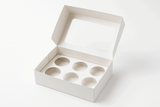 A professional product photo of an elegant six cupcake box packaging on a white background, designed to hold six cupcakes in a grid arrangement