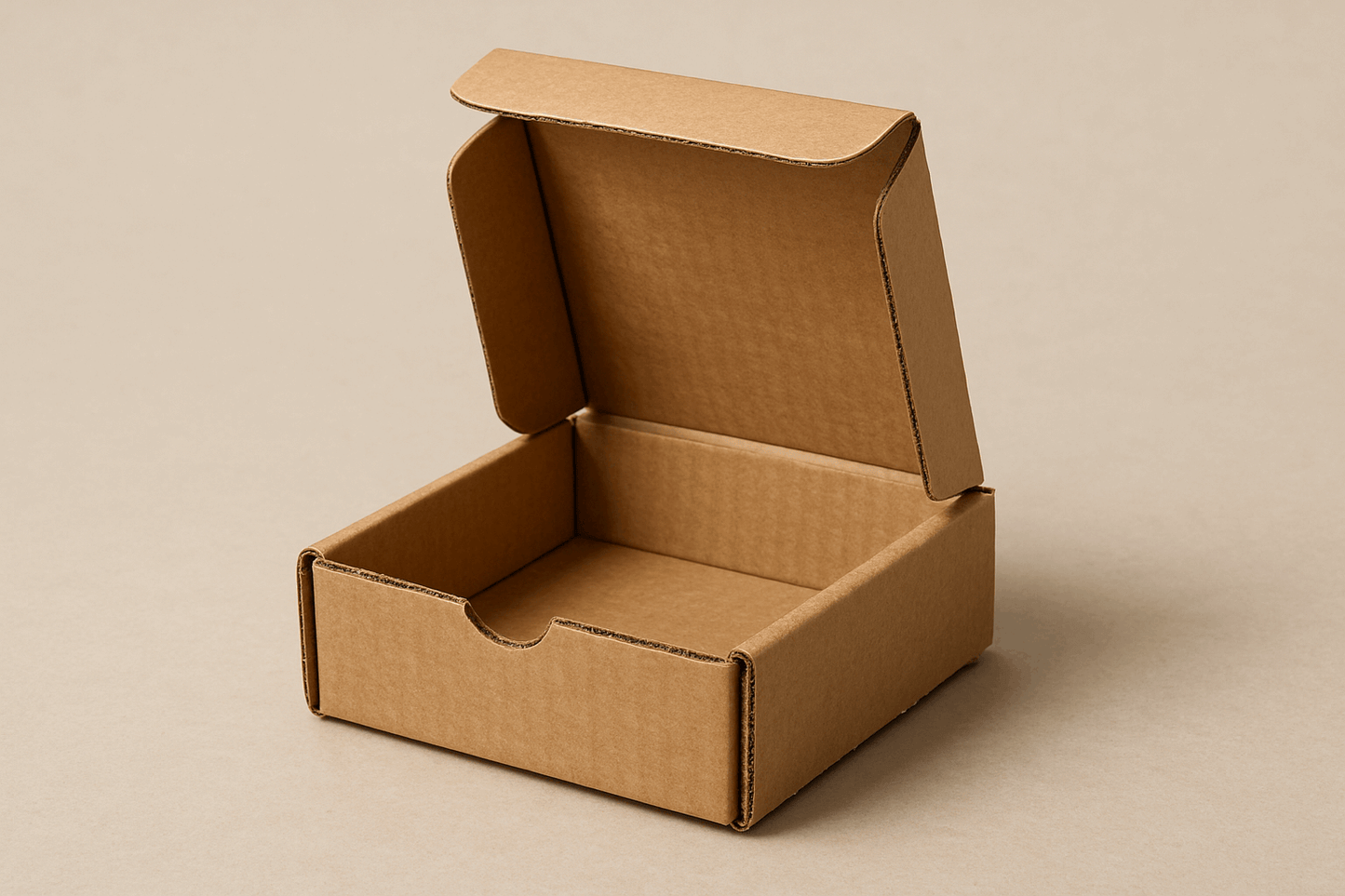 A realistic image of a compact 6.5x6.5x2.5 inch corrugated cardboard box with a square shape and neatly folded flaps. The empty box shows visible corrugated texture and fluted layers, highlighting its durability despite its smaller size. The box is displayed against a neutral background, showcasing its practicality for shipping smaller items weighing up to half a kilogram.