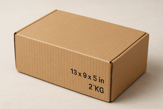 A realistic image of a rectangular 13x9x5 inch corrugated cardboard box with securely closed flaps. The empty box displays visible corrugated texture and fluted layers, highlighting its durability for shipping medium-weight items up to 2 kilograms. The box is positioned against a neutral background, showcasing its sturdy construction and recyclable nature, perfect for reliable e-commerce shipping of books, electronics, or packaged food.