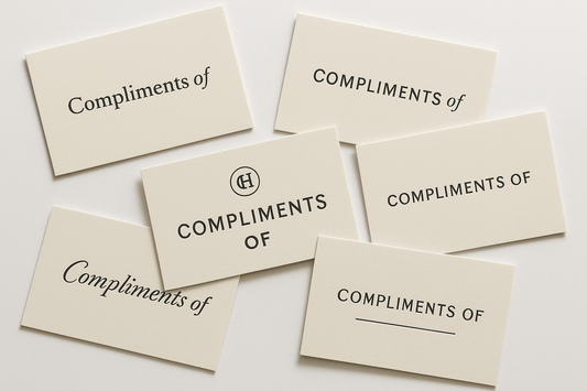 Professional compliment cards with elegant typography and minimal design on premium cardstock