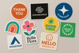 Realistic customized stickers in various shapes and sizes with vibrant colors and professional printing quality